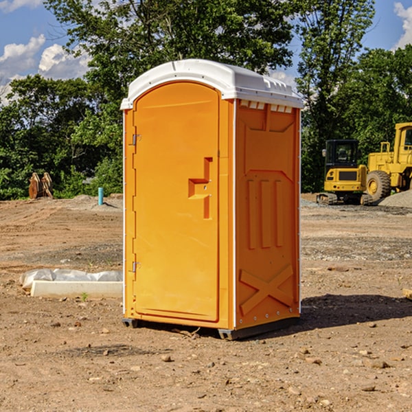 what is the cost difference between standard and deluxe portable restroom rentals in Trinity